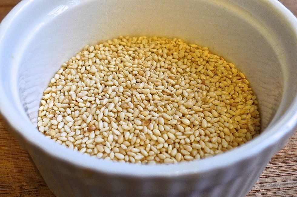 Toast white sesame seeds.