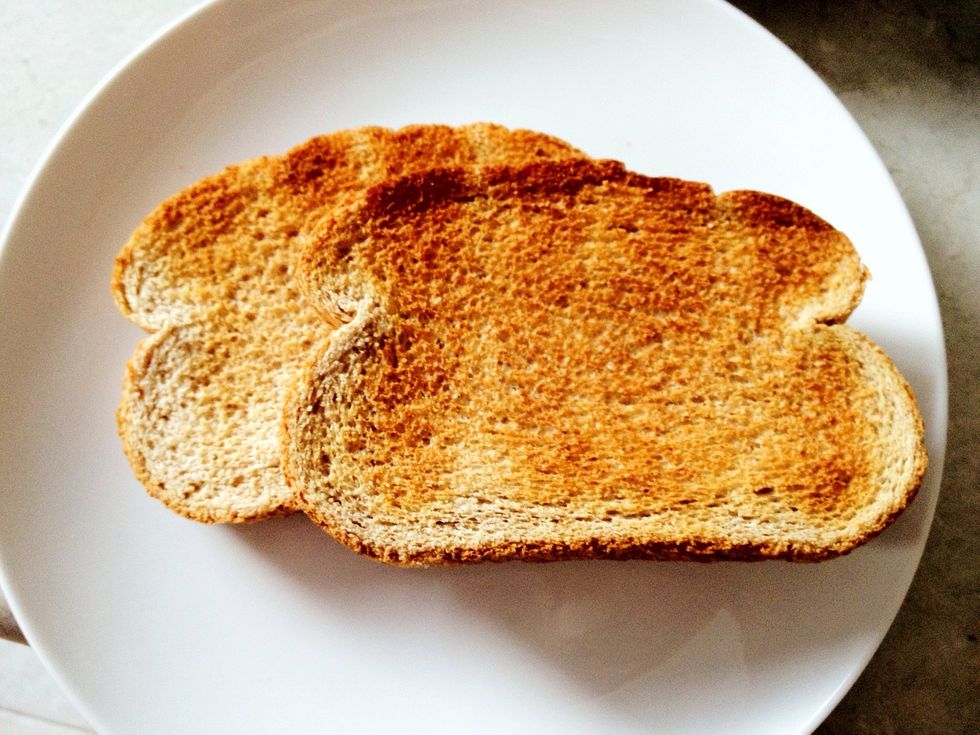 Toast your 2 piece of whole wheat bread.