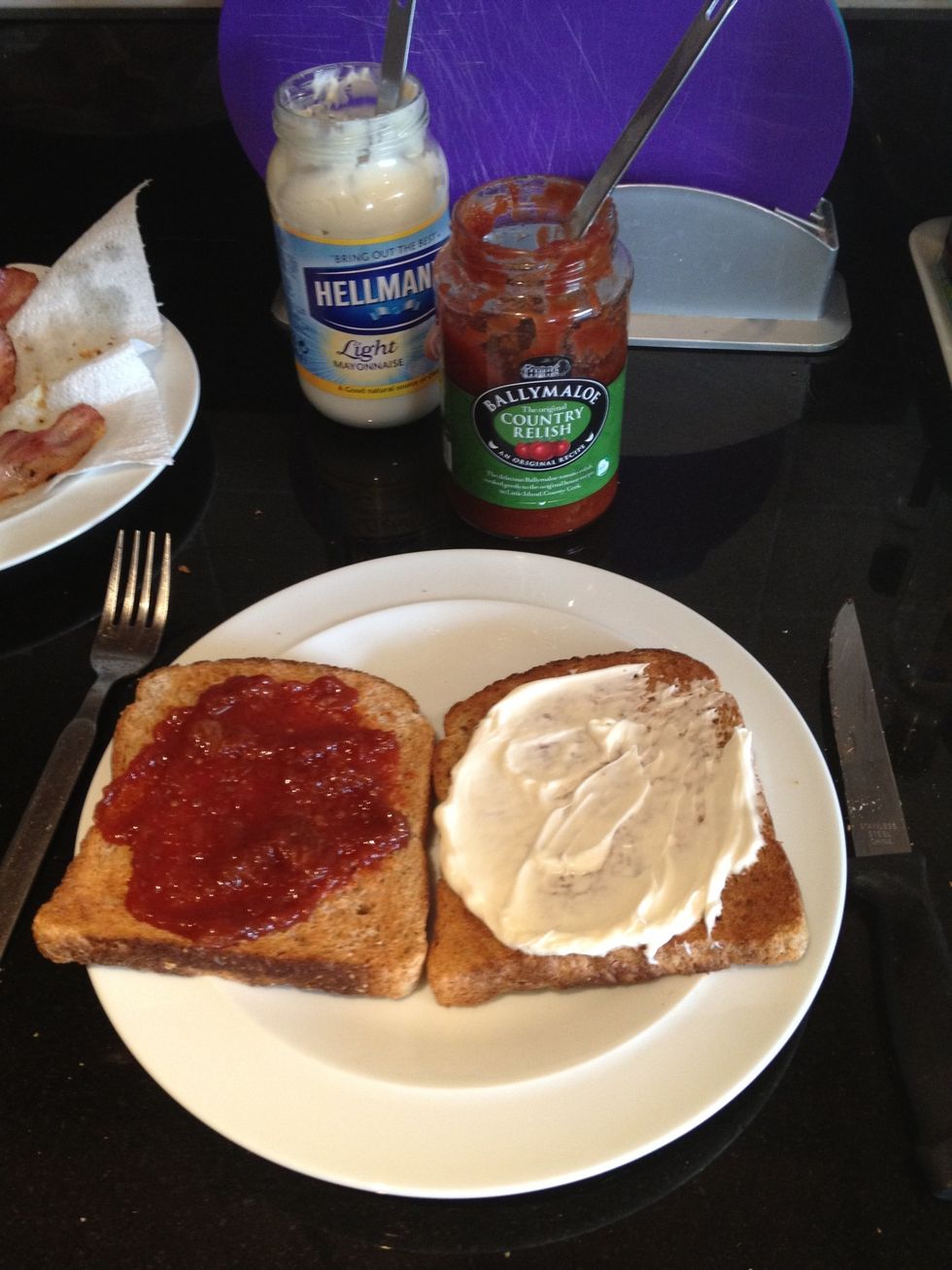 Toast your bread and spread one slice with mayo and one with tomato relish.