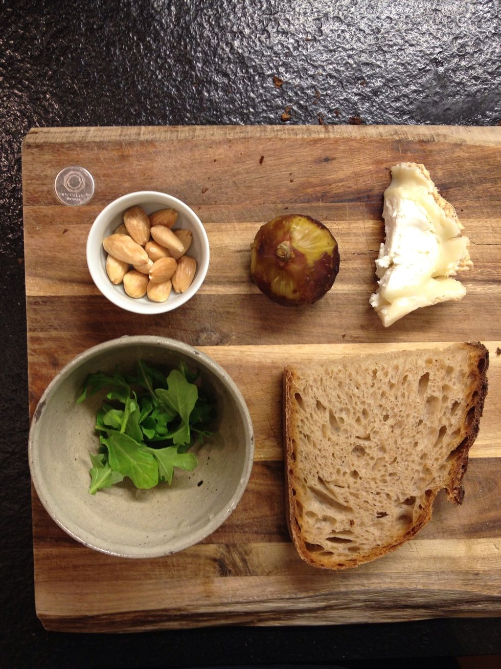 Toasted almonds, goat cheese, fresh fig and arugula.