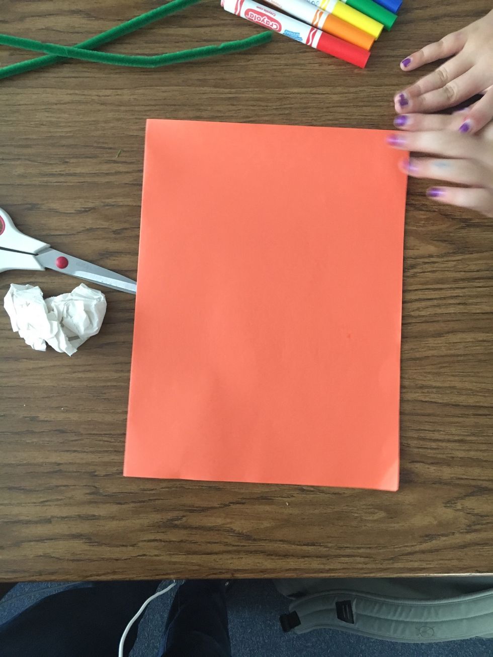 Today, we are going to make a pumpkin! It will be super fun!!First, fold the construction paper in half, so that it looks like a book.
