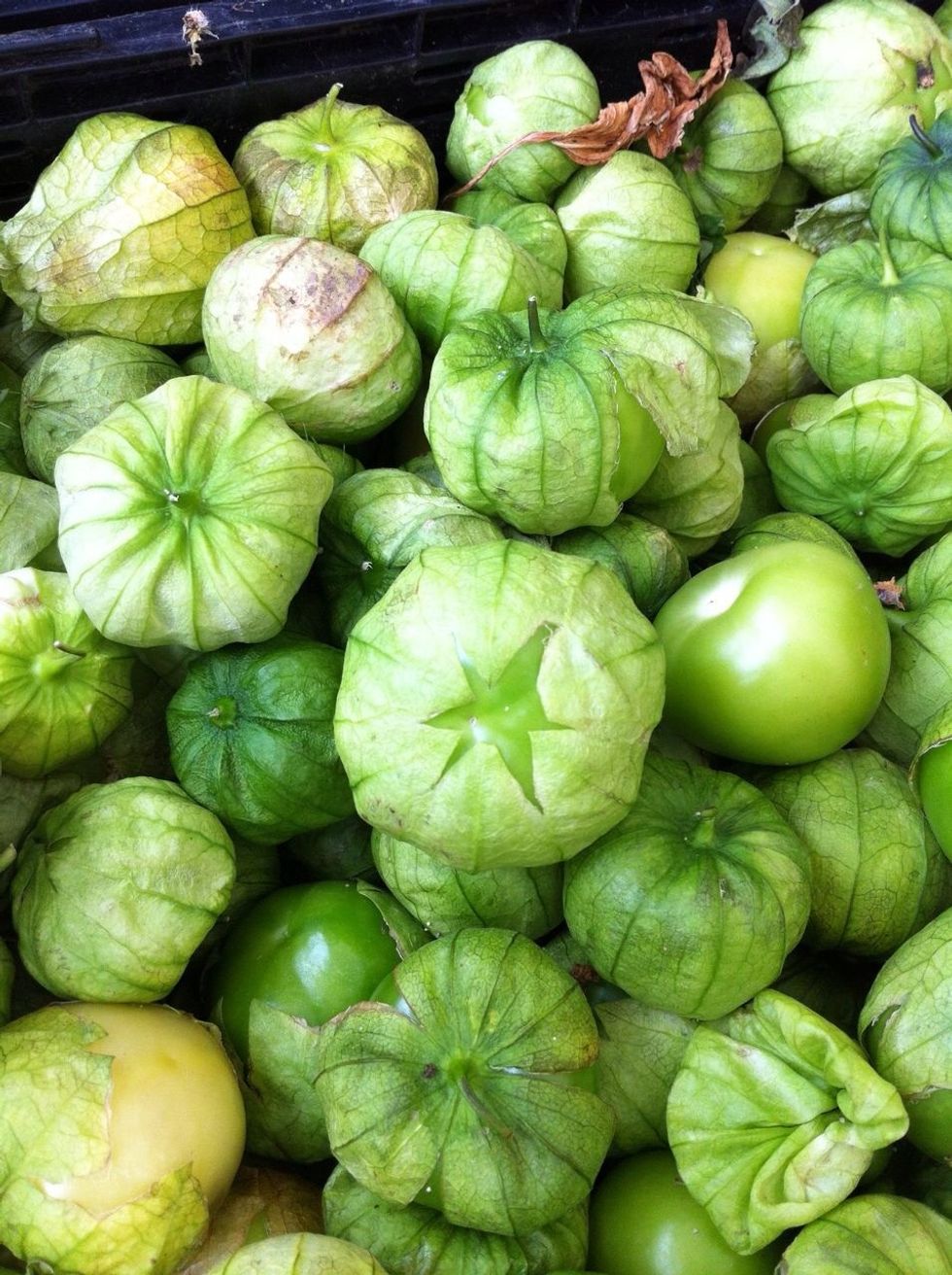 Tomatillos look like this when you buy them. Peel off the papery husk and wash the fruits thoroughly because they are sticky.
