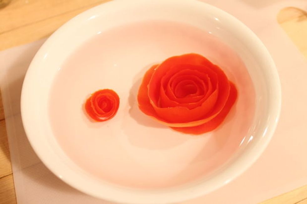 Tomato roses can be covered and refrigerated for several hours or overnight. The cold water will help maintain the freshness and enhance the appearance when used later.