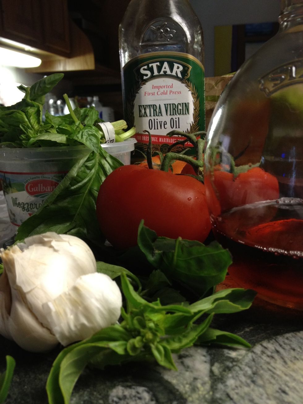 Tomatoes, Basil, Garlic, Red Wine Vinegar, Extra Virgin Olive Oil, Motzerella Medallions.