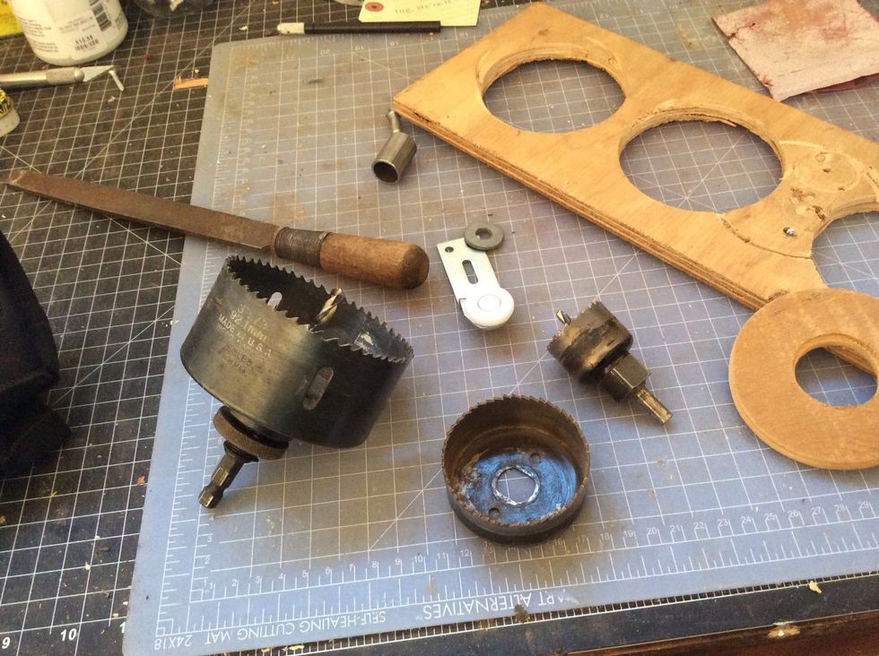 Tools! 3 circular drill bits. 1 inch thick board for the wood. Also one example of a wheel that is cut out.