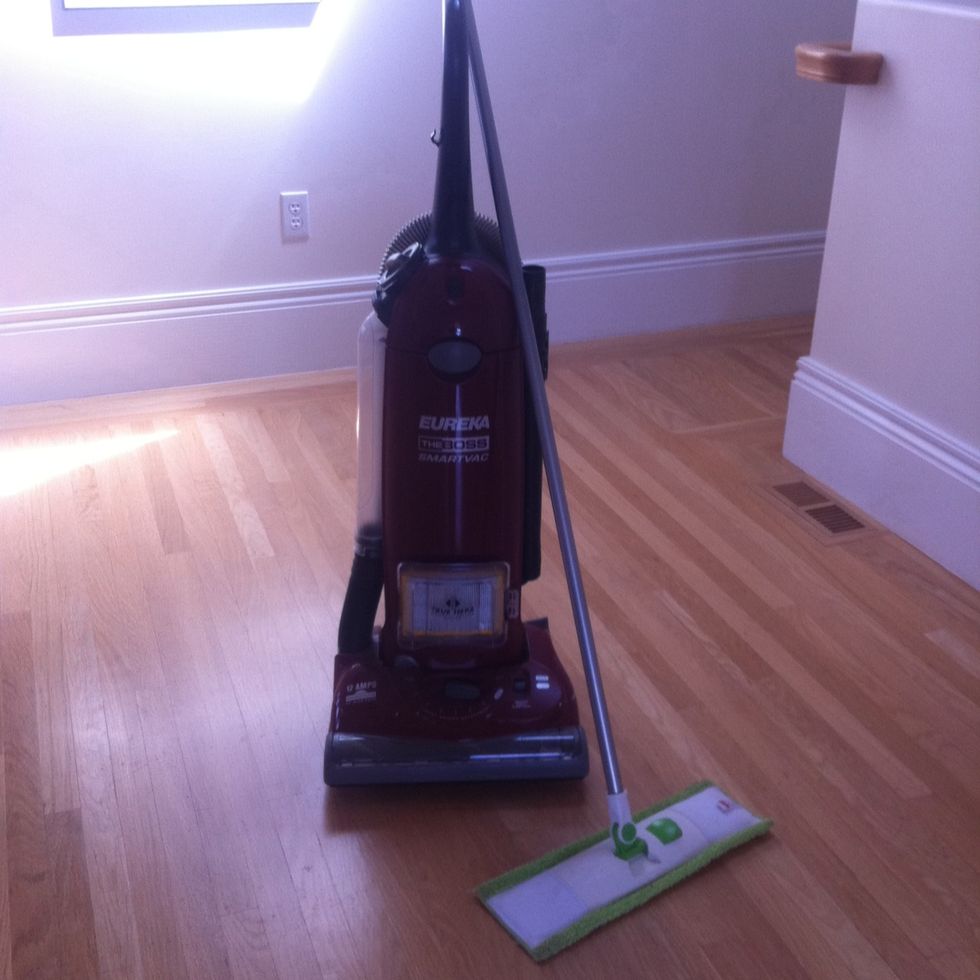 Tools of the trade: a vacuum and a microfiber mop..