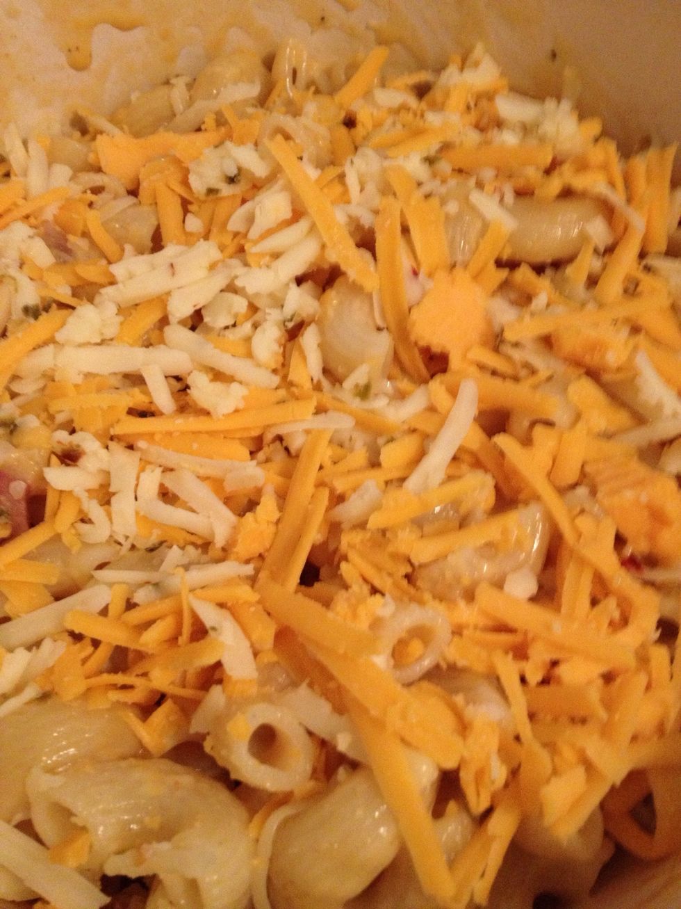 Top macaroni and cheese with remaining grated cheese followed by bread crumb and cheese mixture.