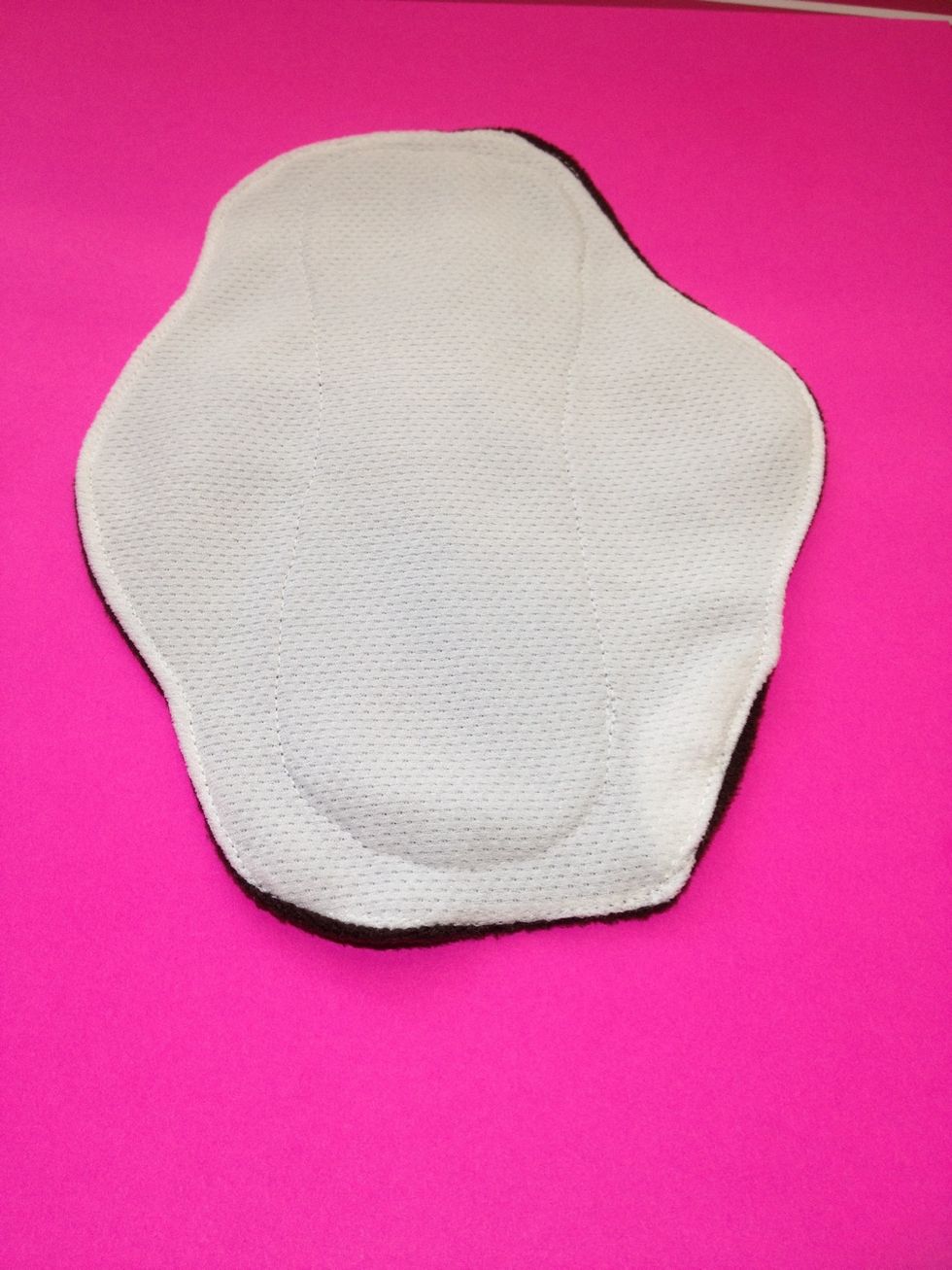 Top of pad after top stitching. Mesh-side of stay dry fabric is facing body. Contour inner is defined subtly by white stitching, which would also be subtle around edges if I was a better sewer!