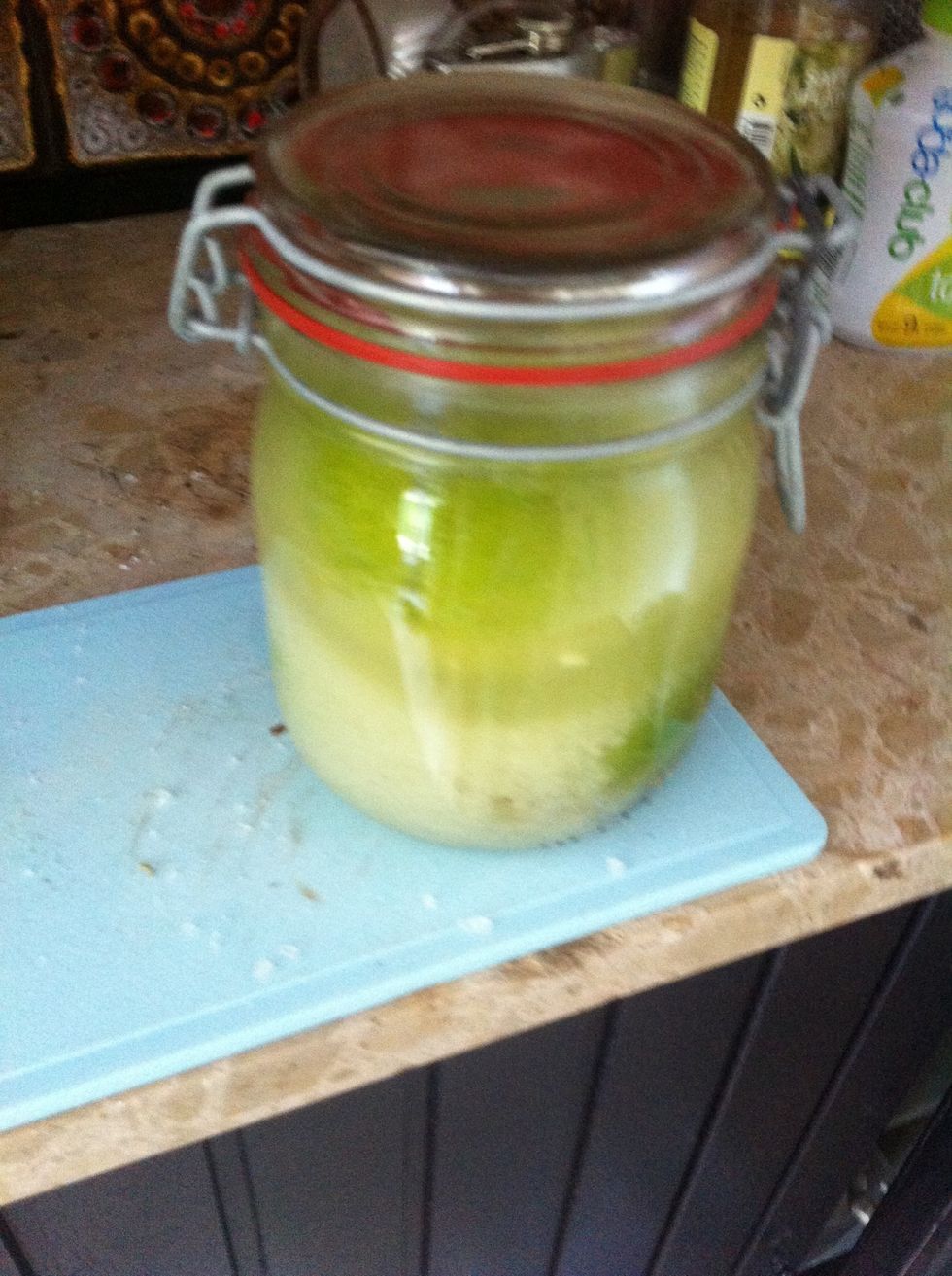 Top of with water until the lemons are submerged. Close the jar and shake vigorously.