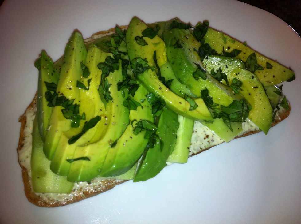 Top off the sandwich with the chopped basil and extra virgin olive oil.