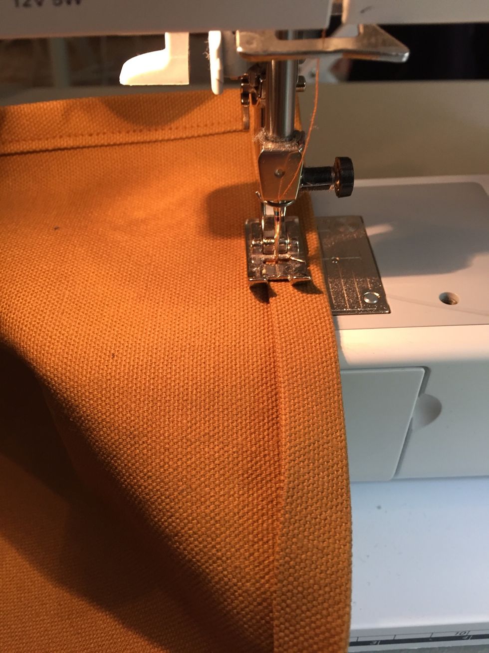 Top stitch around the edge of the fold starting on one of the short ends. Stitch all the way around the rectangle. Top stitching should be close to the folded edge.