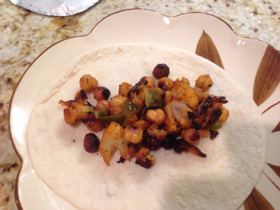 Top tortilla with the roasted mixture and jalape\u00f1os. (The original recipe has more ingredients, including red and green peppers, and more steps.)