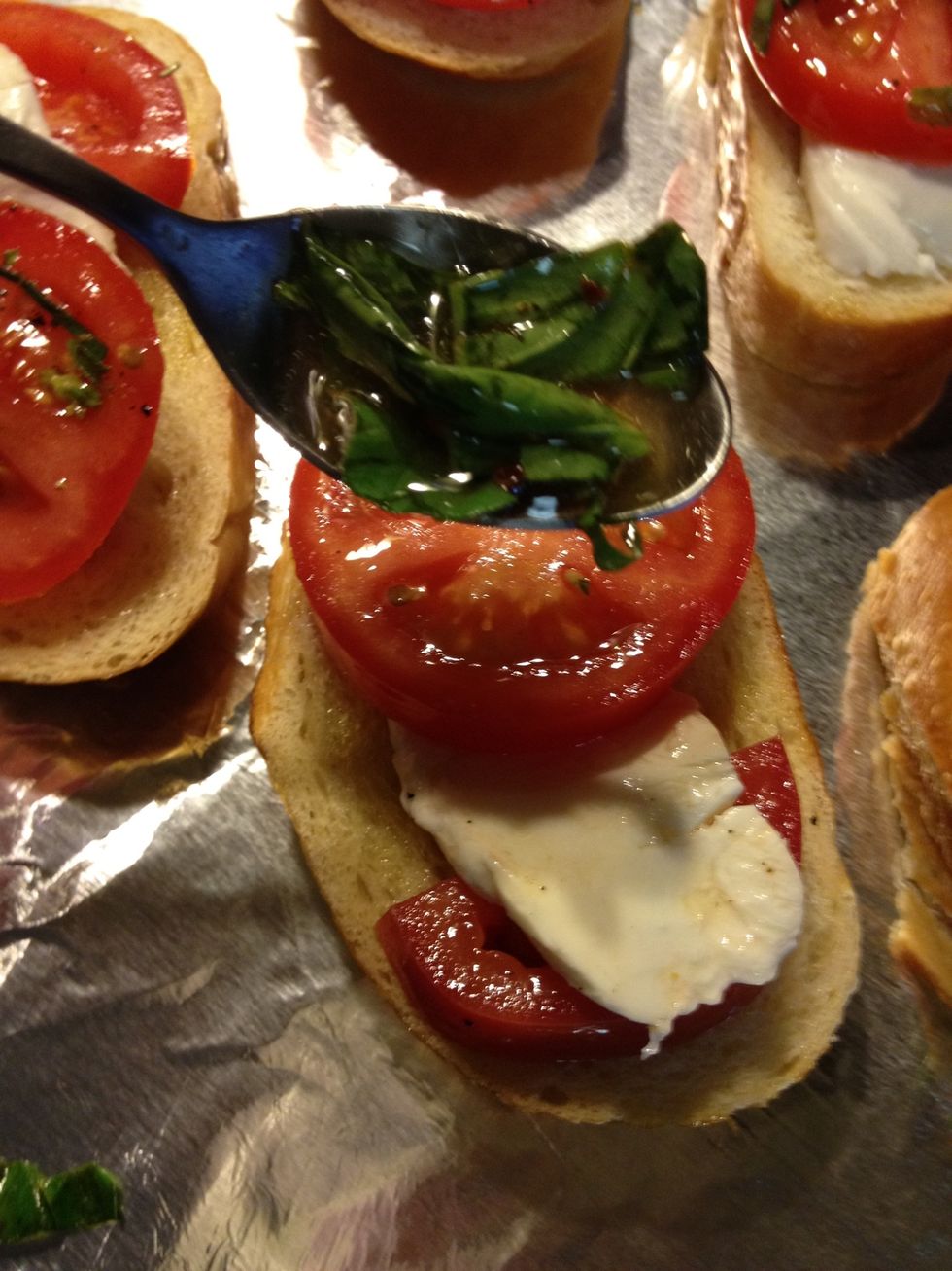 Top with a drizzle of the marinade and basil