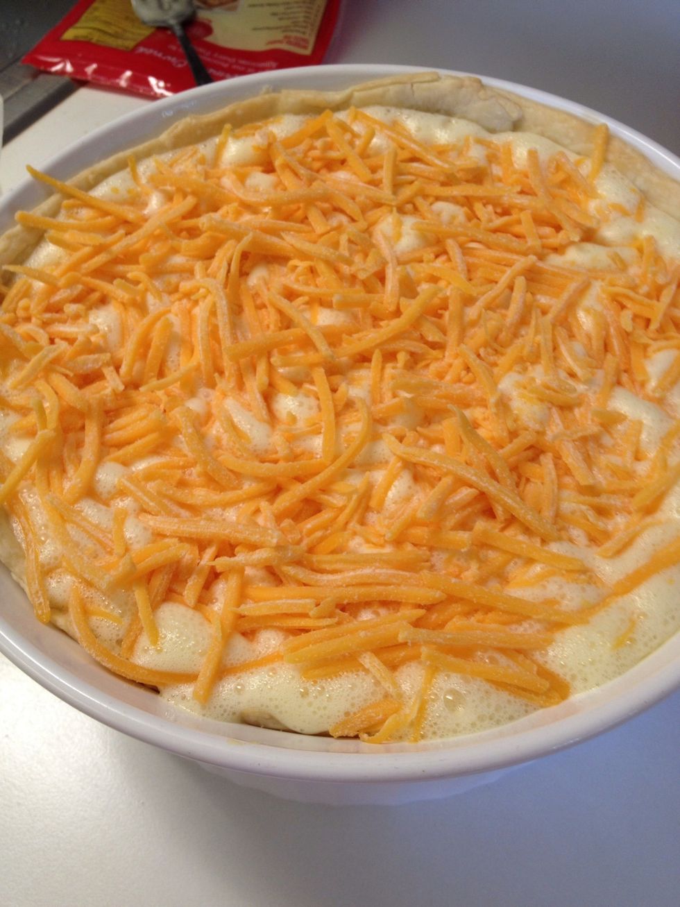 Top with cheese and bake for 35-40mins. Or stick a fork in the middle until comes out almost clean.