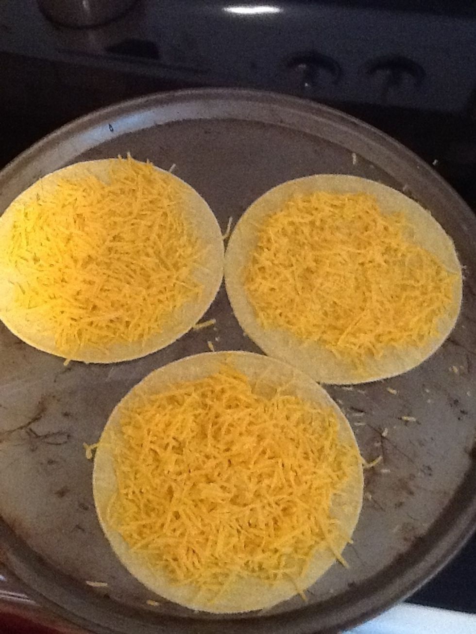 Top with cheese. I did one batch in cheddar and the other in mozzerella.