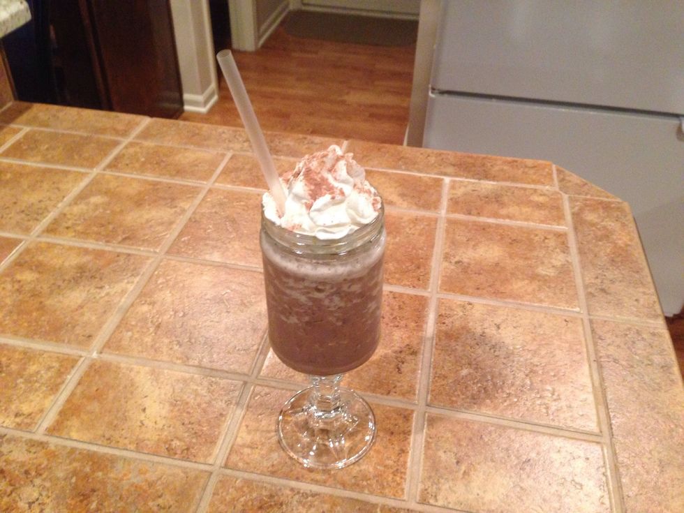 Top with cream and dust with a sweet cocoa powder and enjoy. (This is poured into the homemade red neck wine glass that you can find in my other guide.)