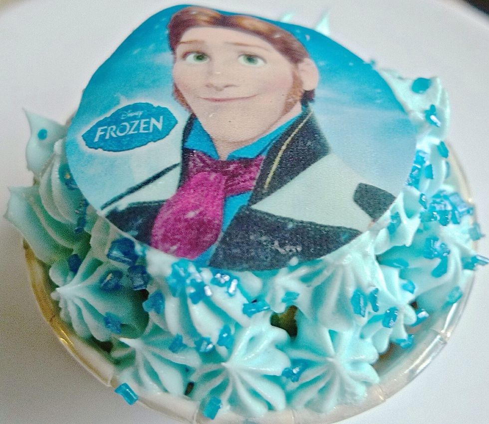Top with Disney frozen edible photo cupcake topper.