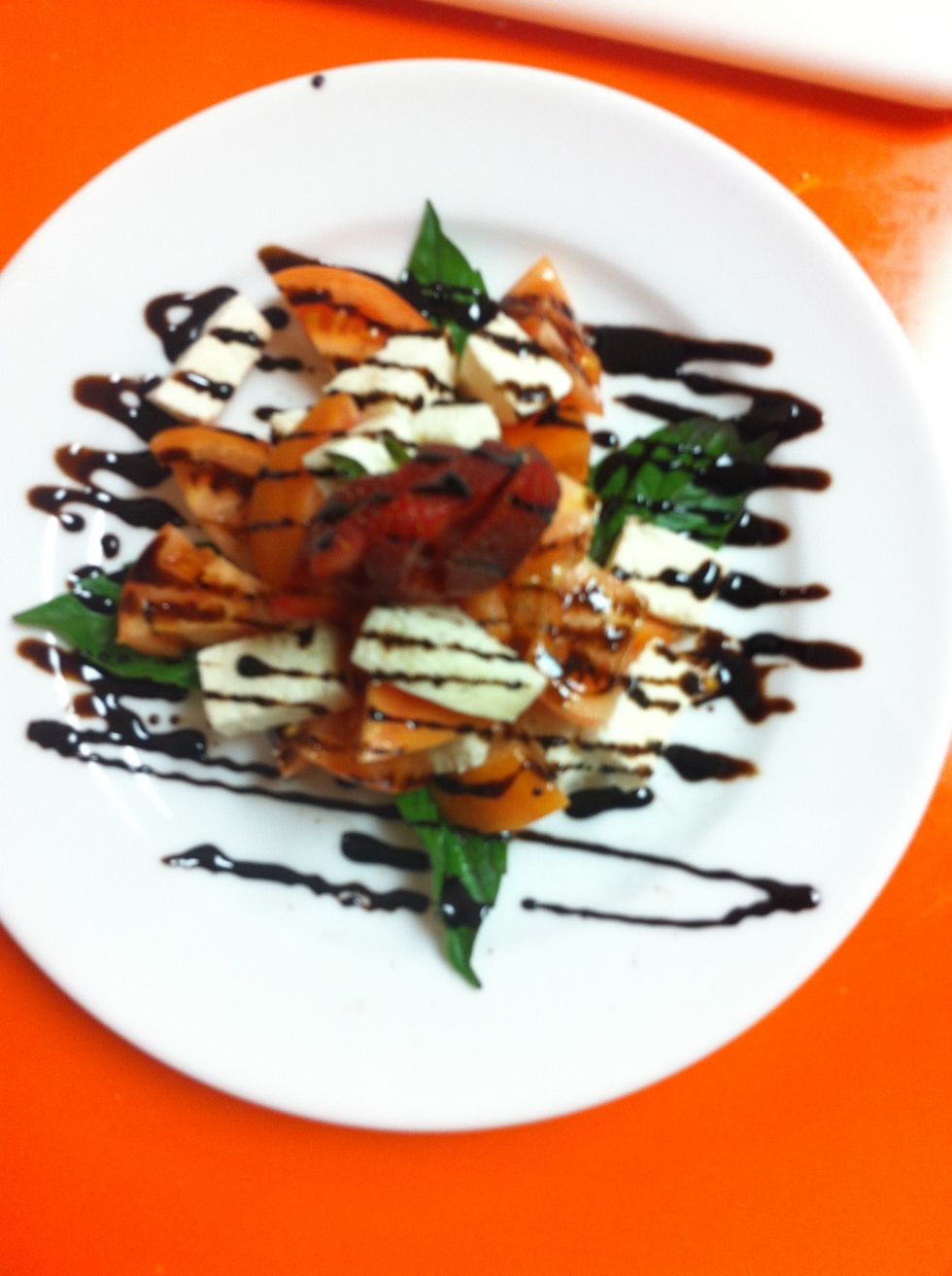 Top with fanned strawberry and Balsamic Reduction as pictured.