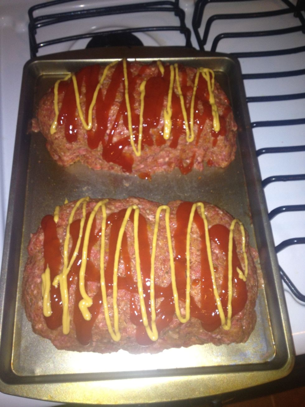 Top with ketchup. We added mustard. Bake for 30-45mins. Making two smaller sizes cuts down on the cooking time \ud83d\ude03