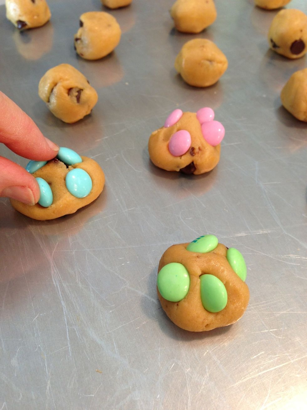 Top with M&M's, pressing in slightly, but keeping dough rounded. Bake 375\u00b0 8-10 minutes. (My oven seems to run warmer. I do 7 minutes.) I suggest 8 rather than 10.