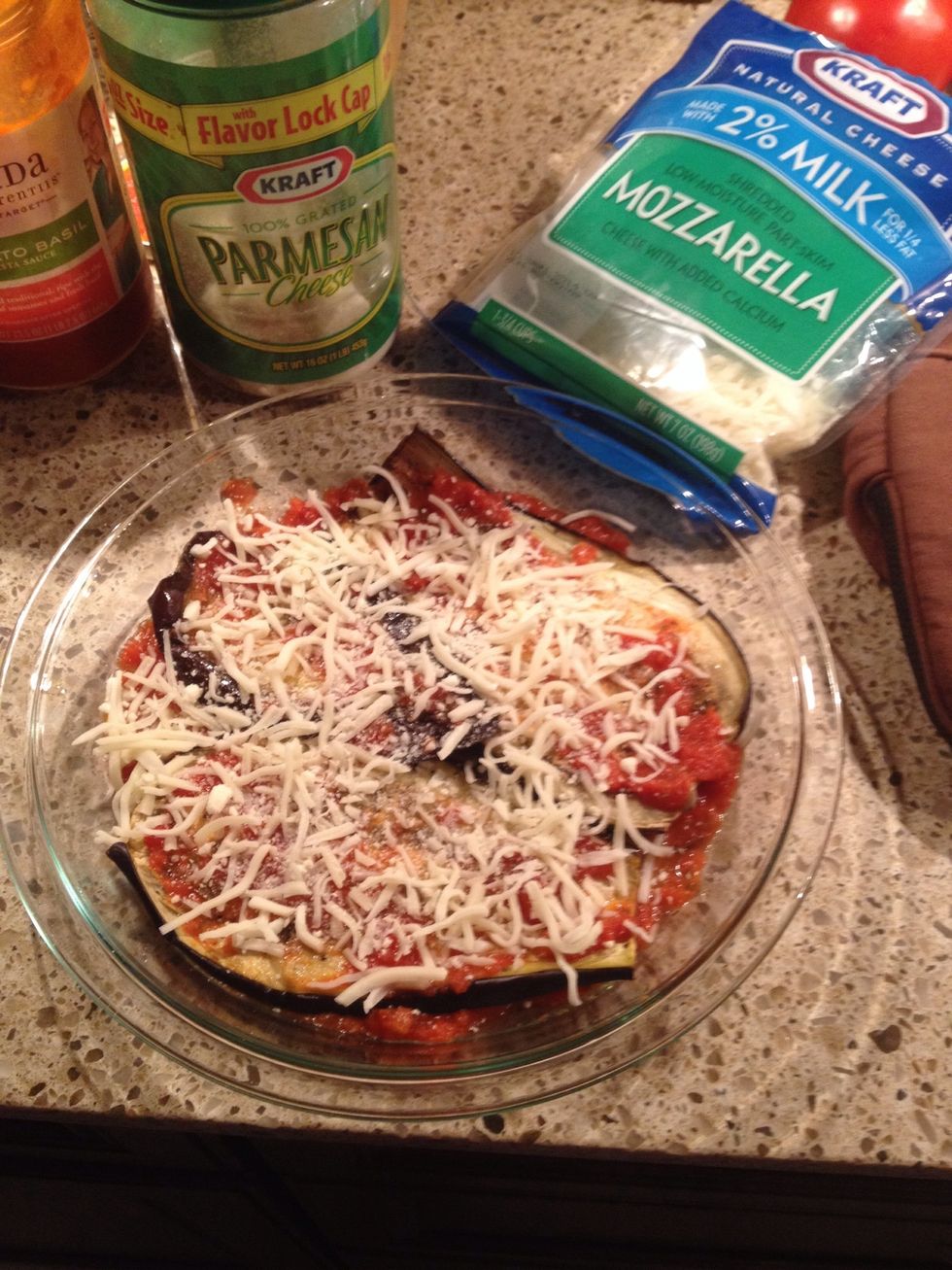 Top with mozzarella or Italian cheese, some Italian seasoning, some crushed red pepper, a touch of garlic powder, and some Parmesan.