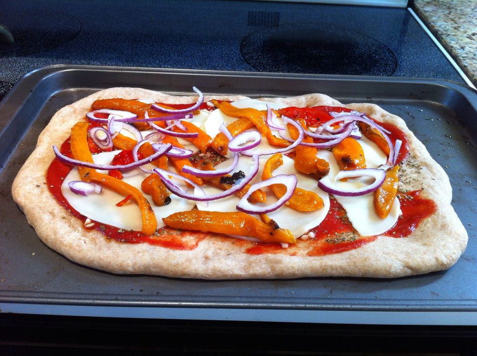 Top with peppers and onion. Place back in the oven and bake another 10 - 15 minutes until cheese is melted.