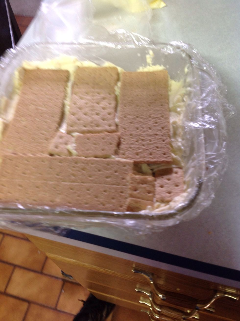 Top with single layer of graham crackers (break to fit).