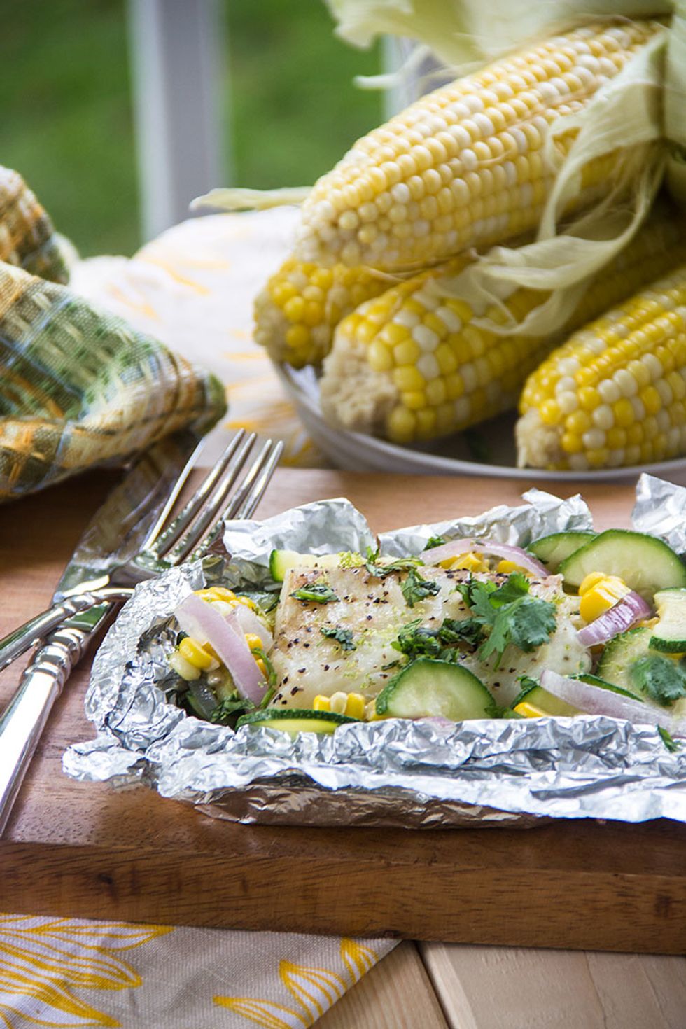 Top with the freshly chopped cilantro. Serve right out of the foil to preserve all of the richly flavored coconut broth.