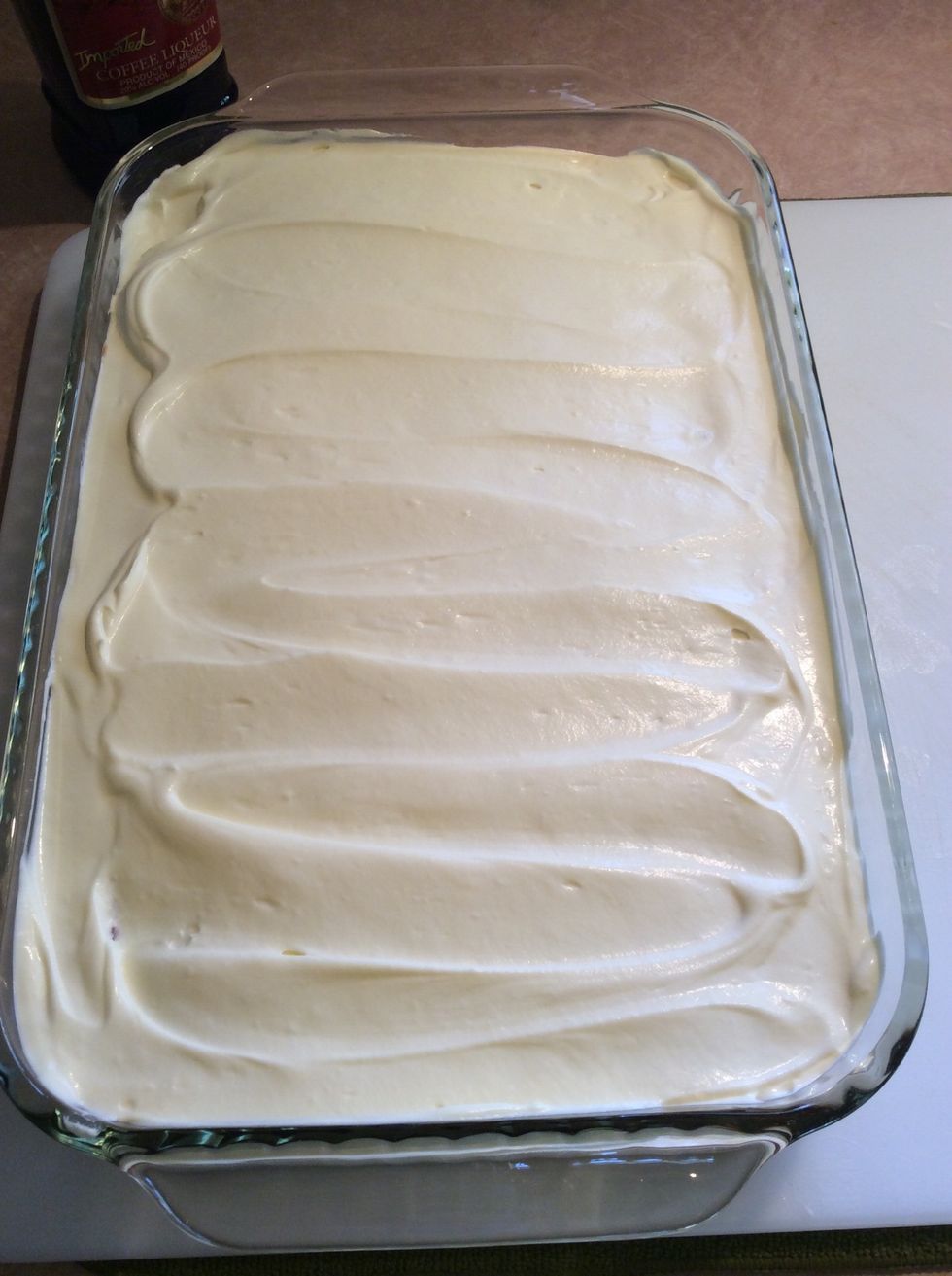 Top with the remaining 1/3 of the whipped cream and mascarpone egg mixture. Spread evenly. Cover and refrigerate overnight.