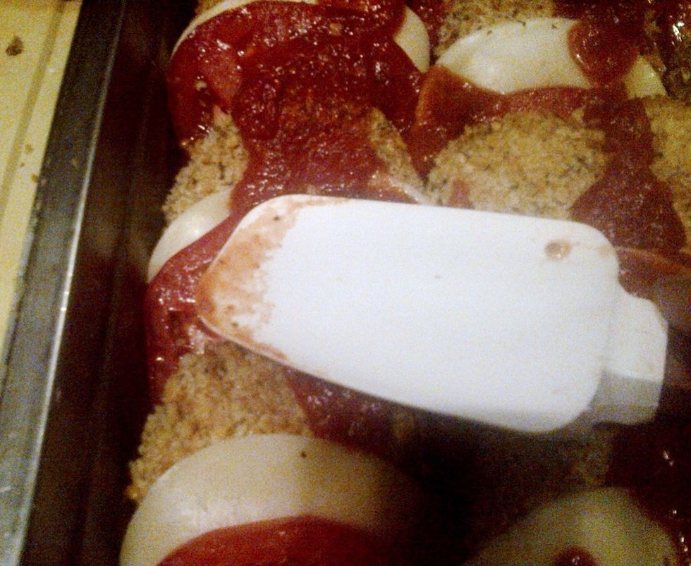 Top with tomato sauce.