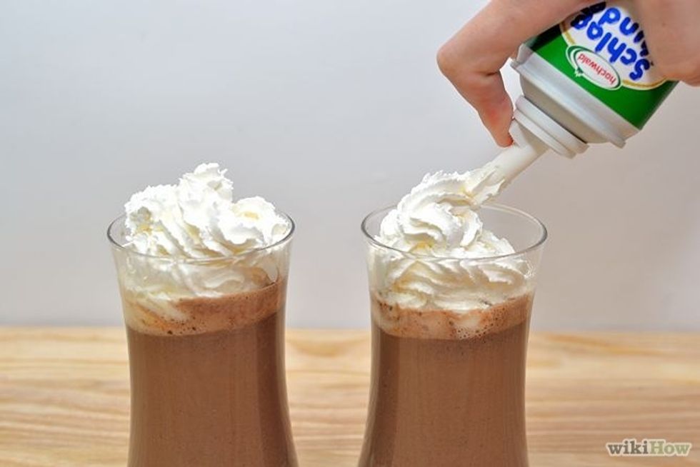 Top with whipped cream and extra pinches of cinnamon and nutmeg (optional).