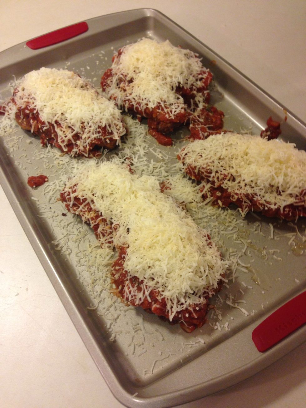 Top your chicken with sauce and as much or little cheese as you want... I was feeling cheesy! In the 400 degree oven for about 7 minutes