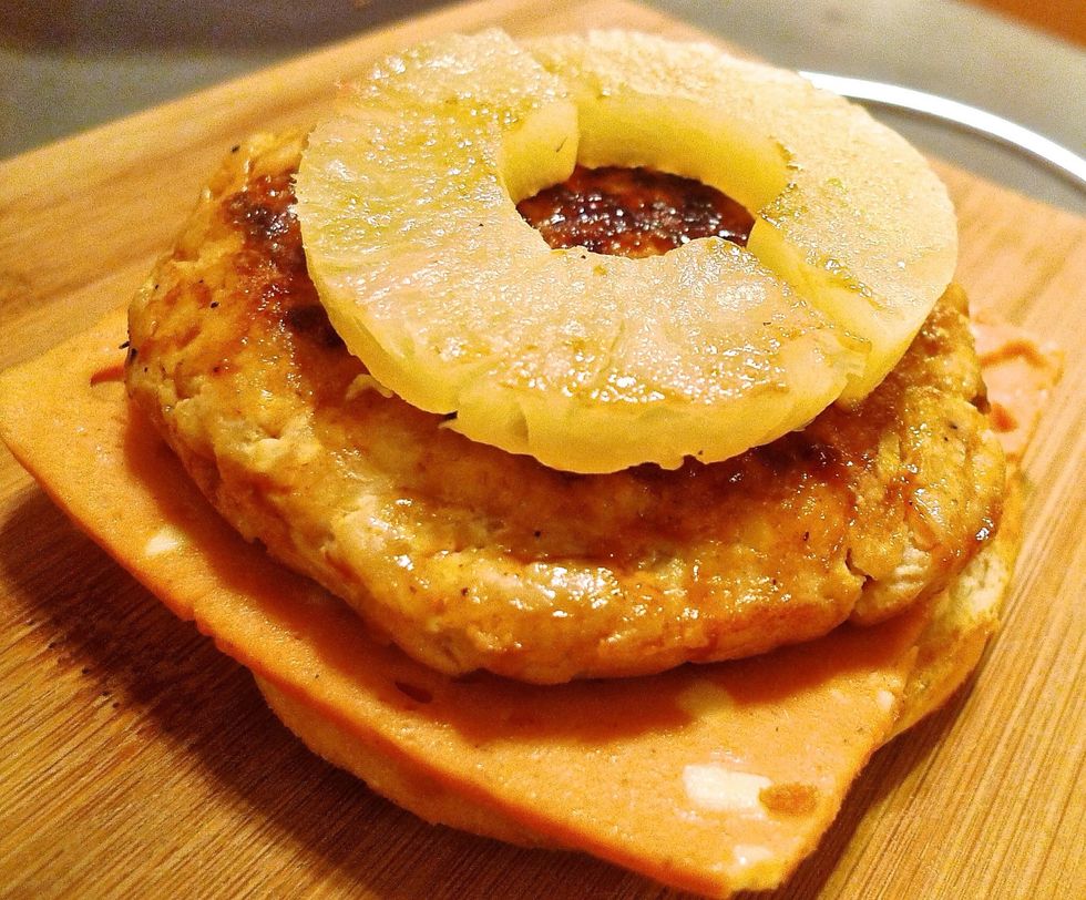 Topped with ring pineapple slices, cut in half