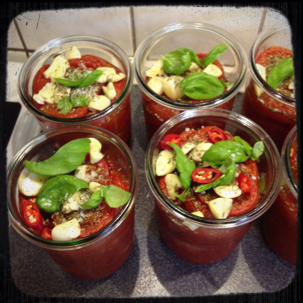 Topping up the jars with garlic, basil thyme and optionally chilli and other of your favourite herbs. Looking good ? \ud83d\ude0d