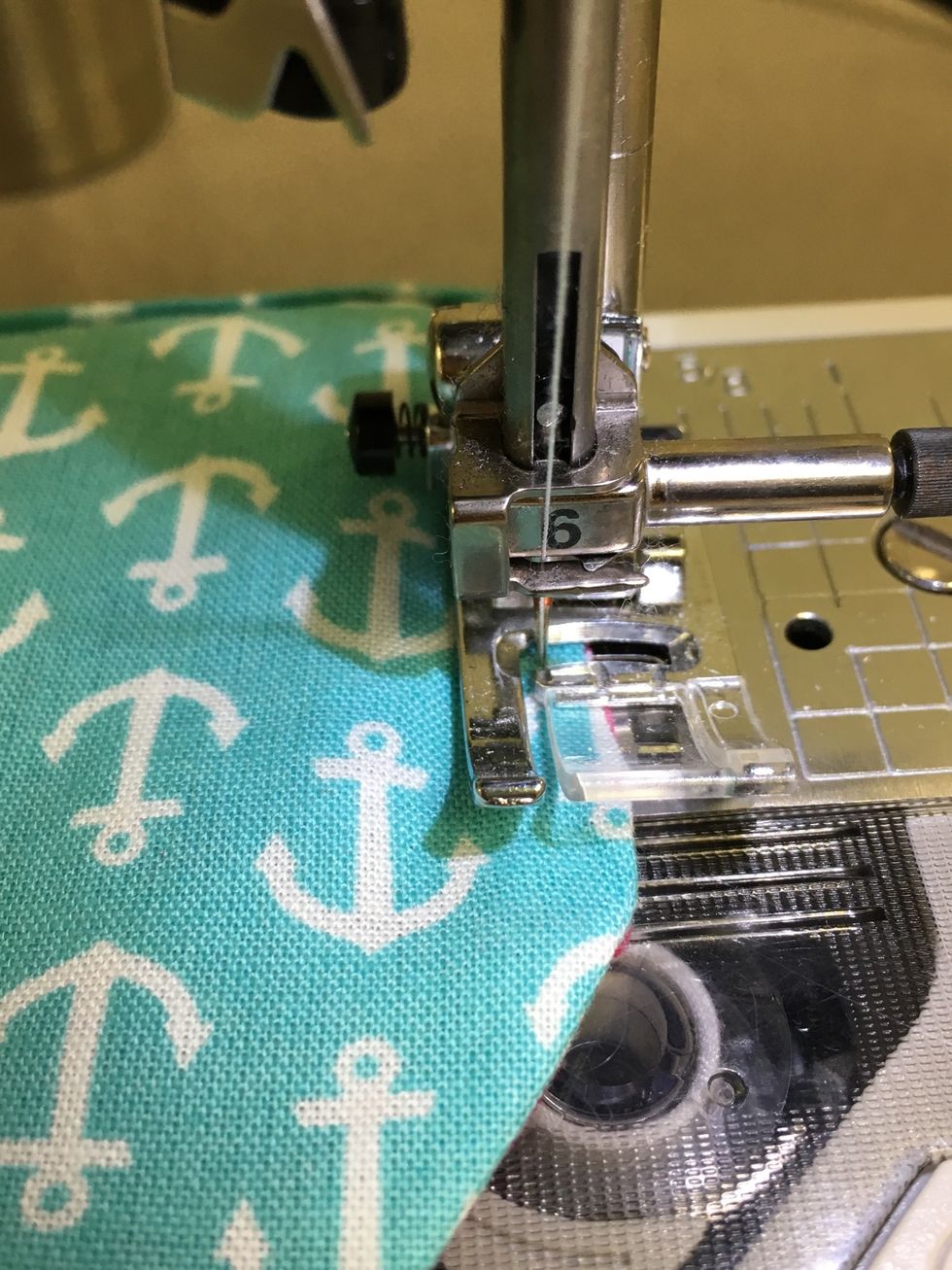 Topstitch 1/8" from the edge almost all the way around. Do not sew over the closure rectangle. Backstitch at all starts and stops.