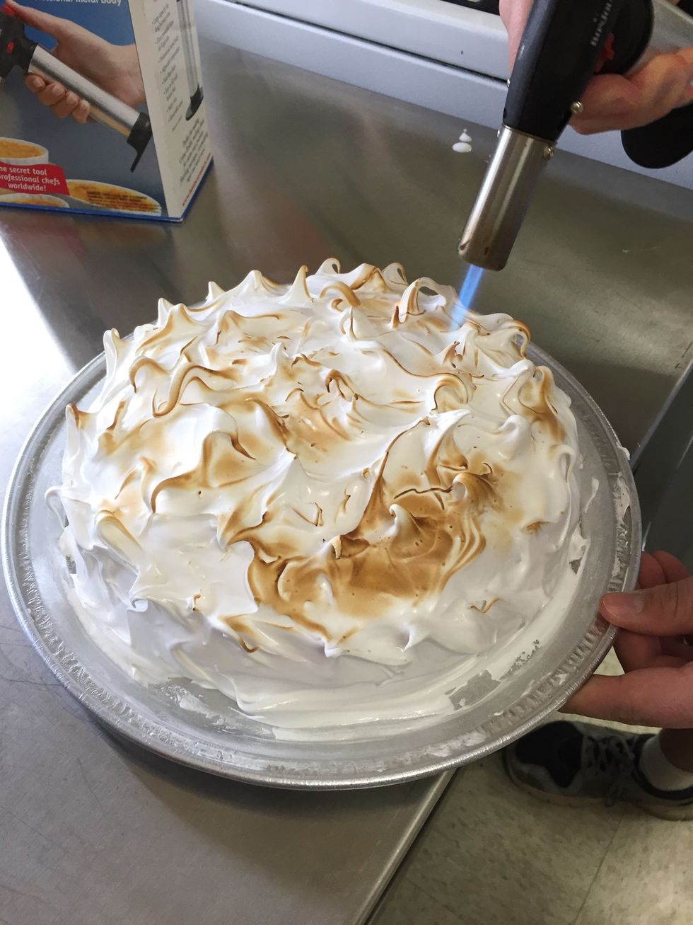 Torch the meringue until desired brownness.
