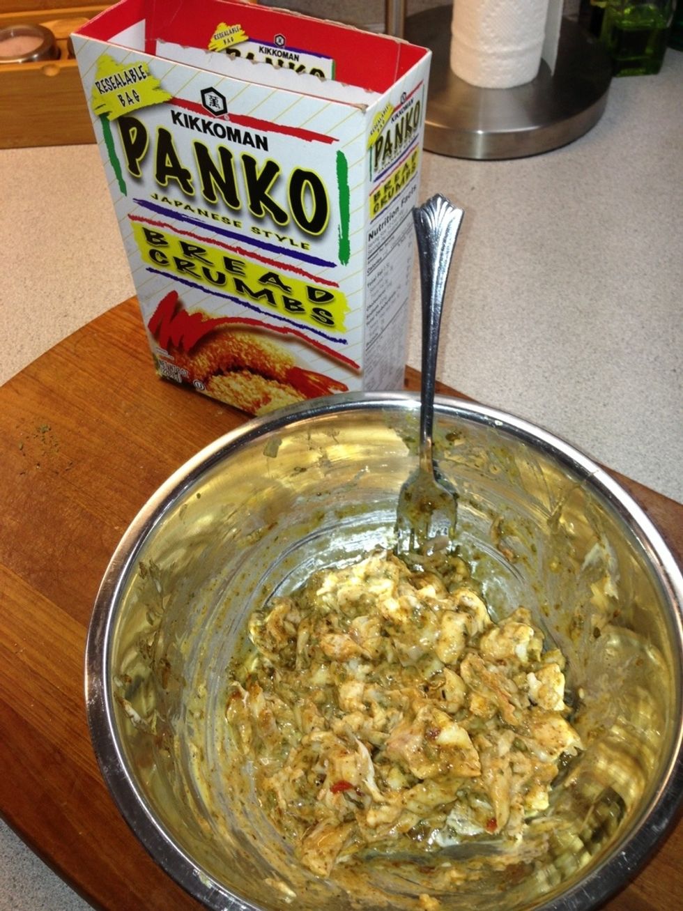 Toss all the ingredients except the Panko until well coated. The consistency should be thick enough to stick together. If its too wet then add a tsp of Panko and stir lightly until its thick enough.