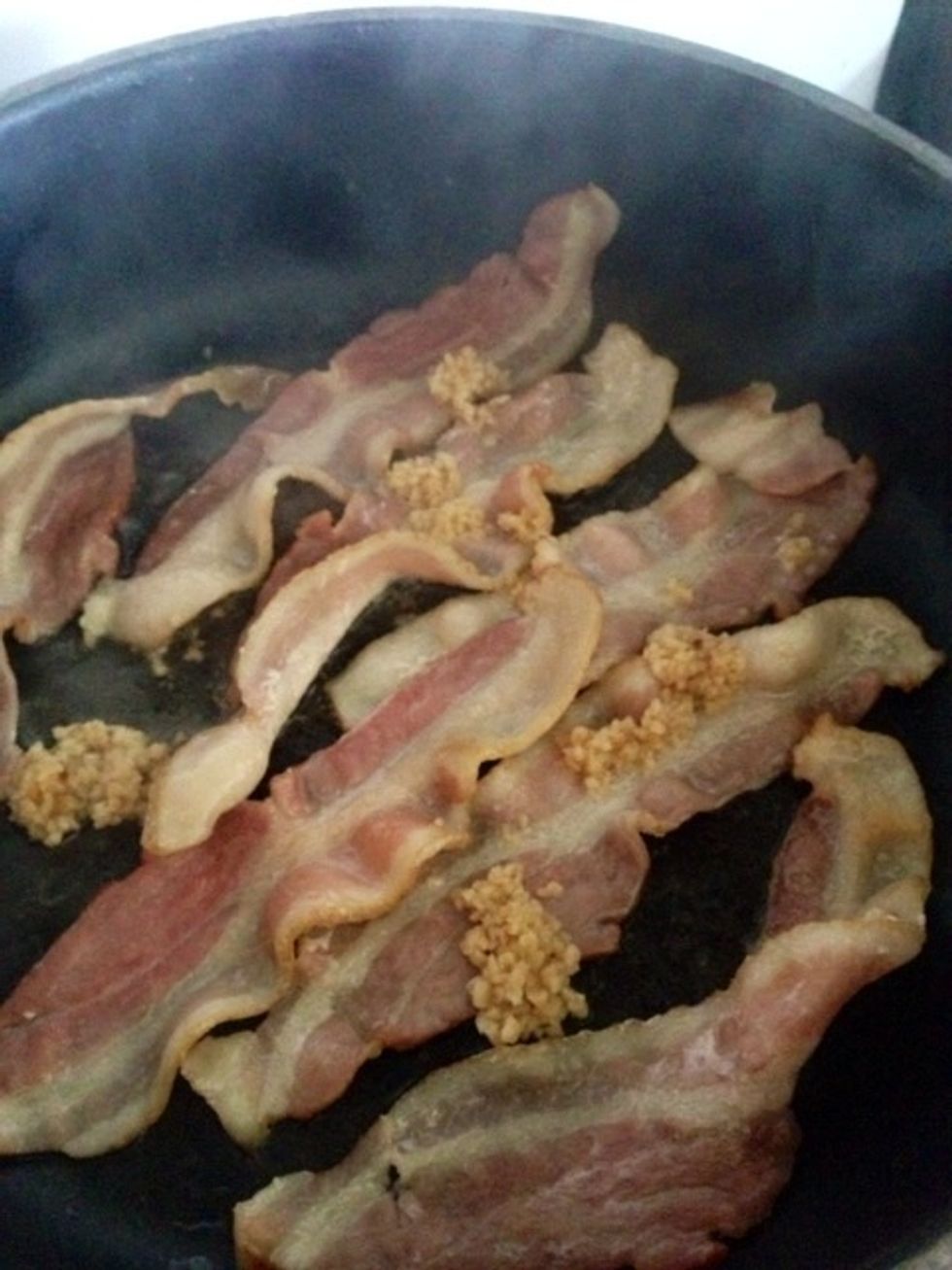 Toss bacon with minced garlic cloves.