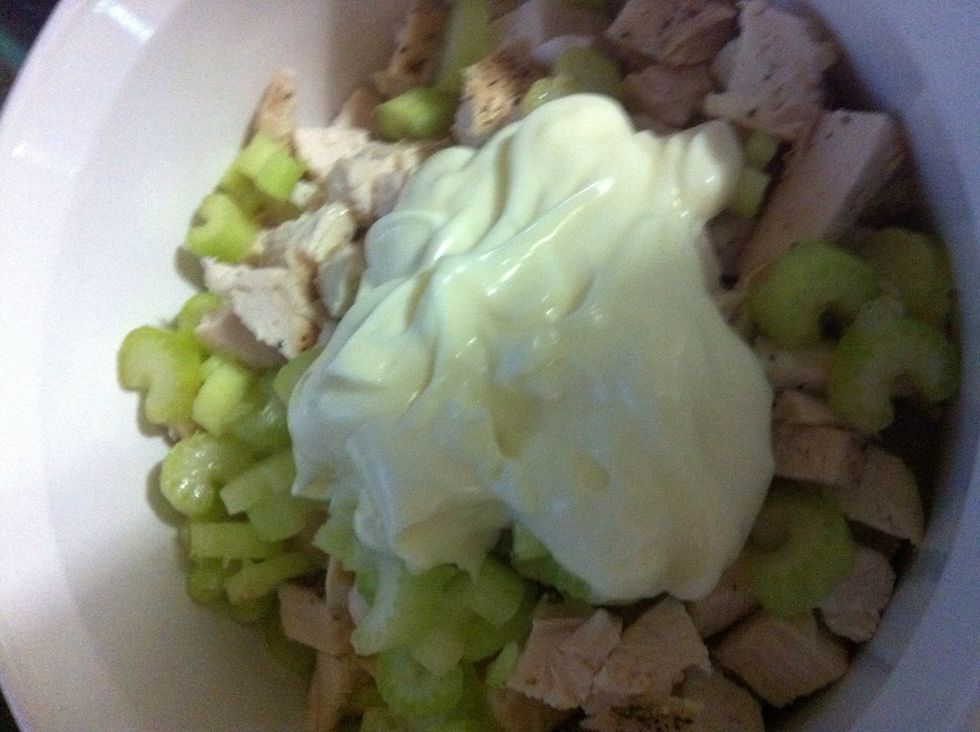 Toss celery and chicken into a bowl. I added 1/3 cup mayo and 1/3 cup sour cream. You can do all mayo, but I substitute sour cream to make it a bit lighter.