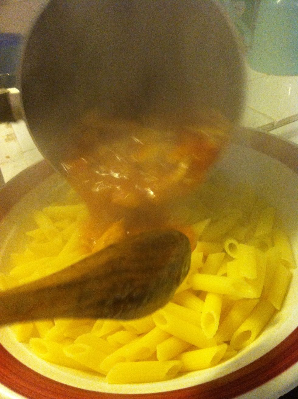 Toss cooked pasta with sauce and cooked chicken