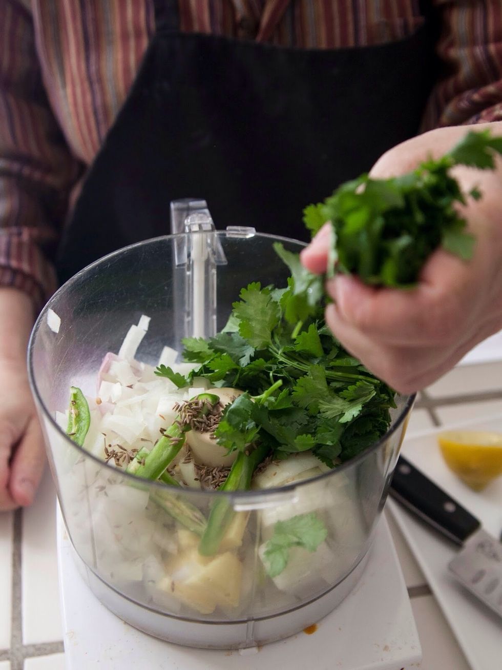 Toss in 1 and 1/2 cups of cilantro...