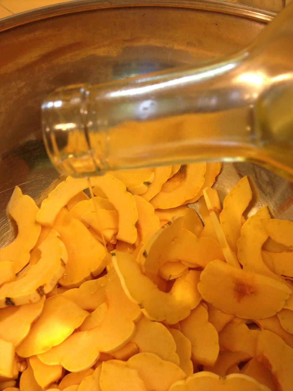 Toss in a bowl with a light coating of olive oil. Use 1 tablespoon or less.