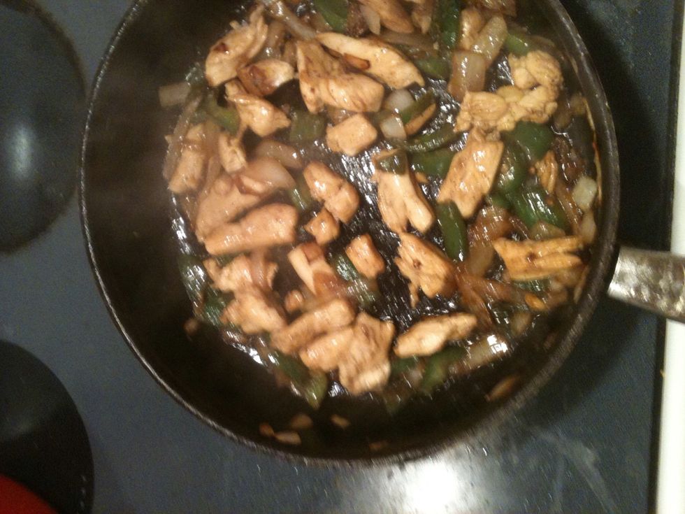 Toss in pan with onion and bell pepper. Add a few splashes of Worcester sauce before chicken cooks all the way.