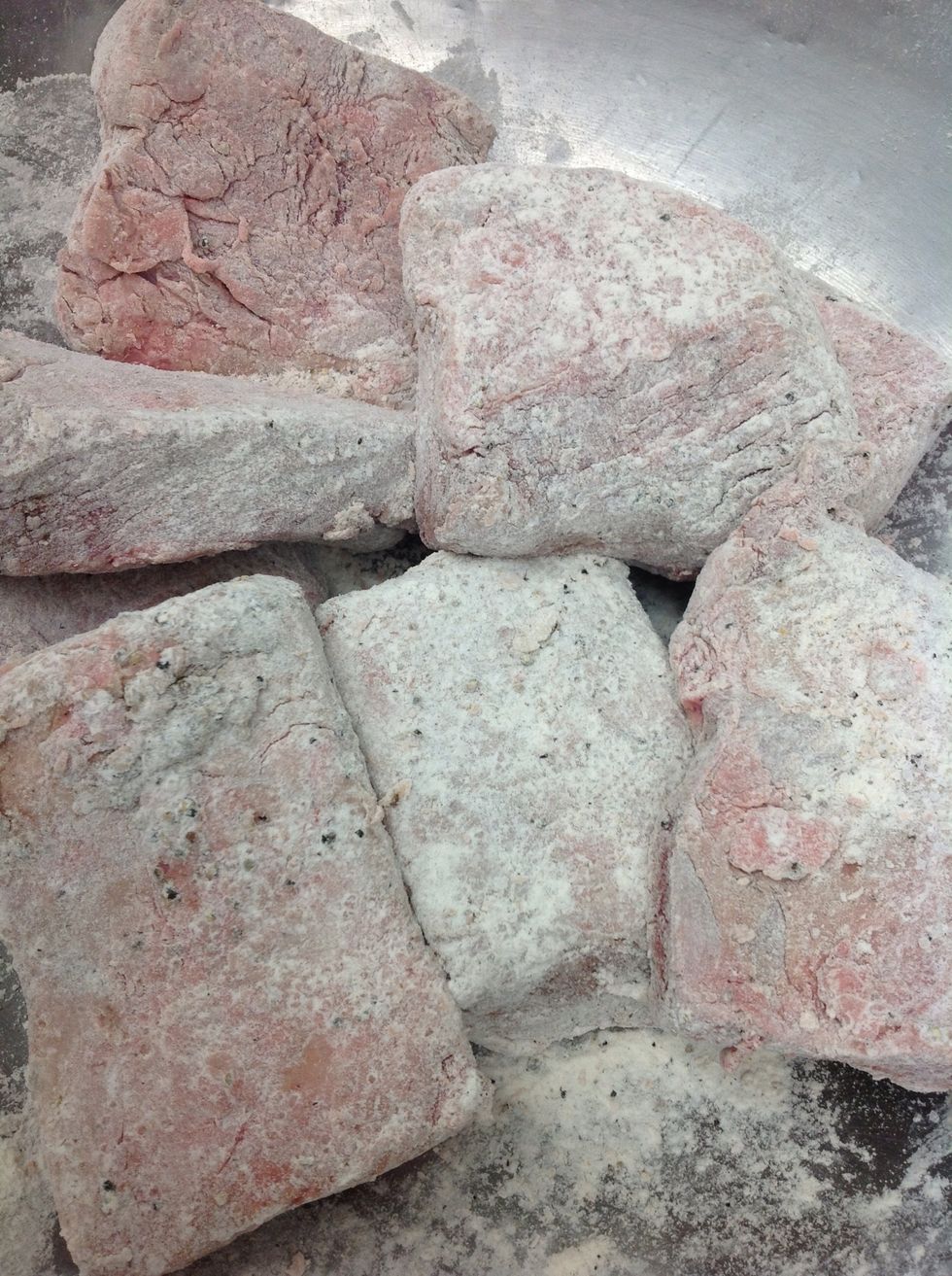 Toss in seasoned flour