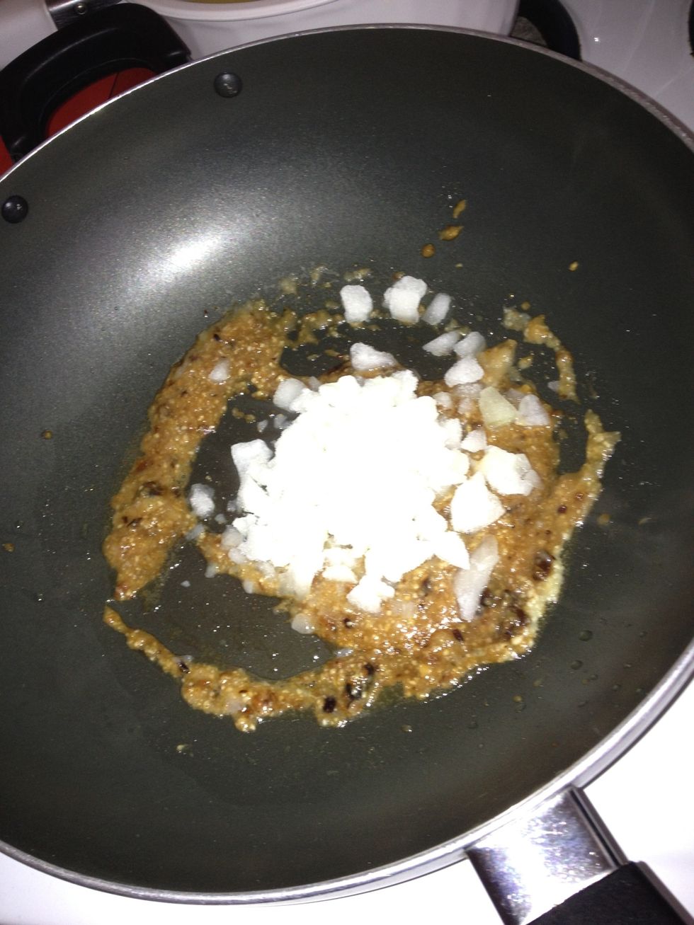 Toss in the diced onion and stir fry until they caramelised.