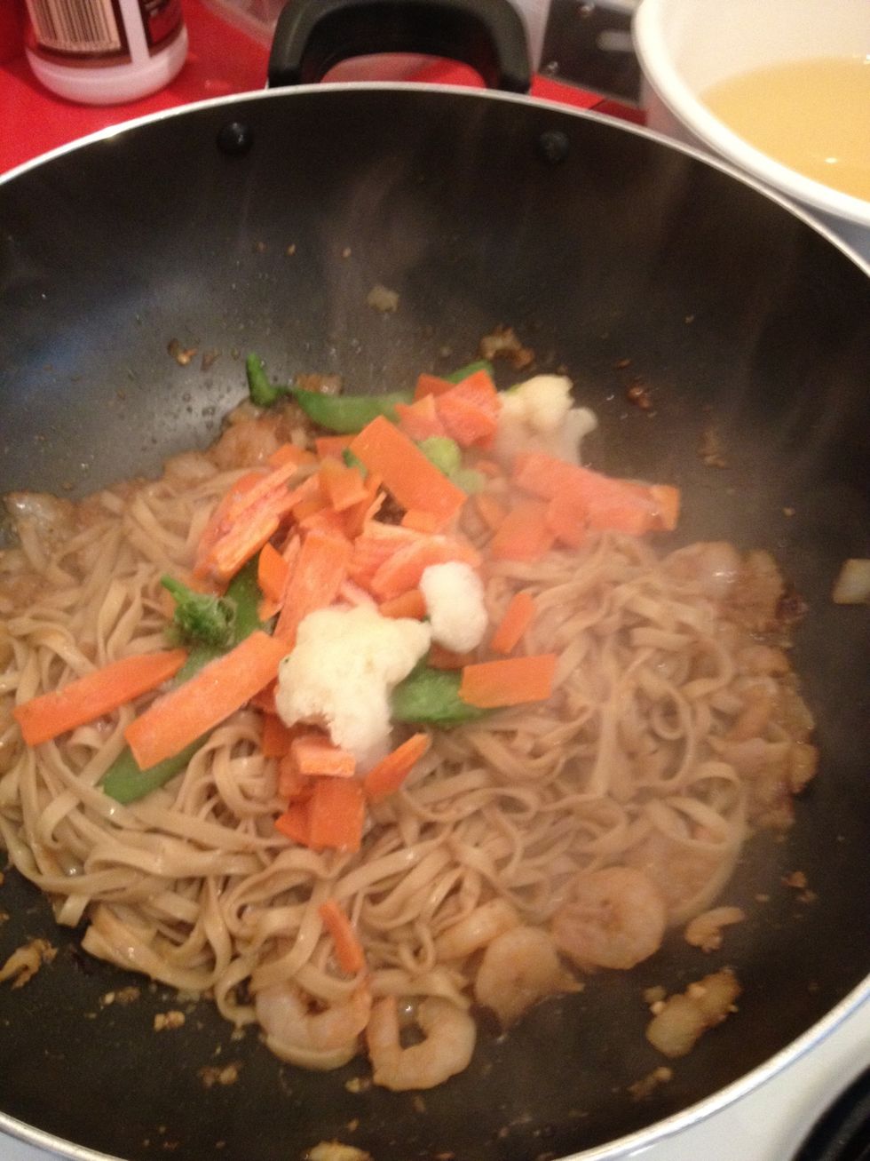 Toss in the mixed vegetables. Stir fry for a couple of minutes.