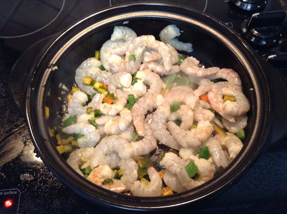 Toss in the raw shrimp that have been rinsed & shells removed. Also at this point, add in all your seasonings- Cumin and S&P to taste.