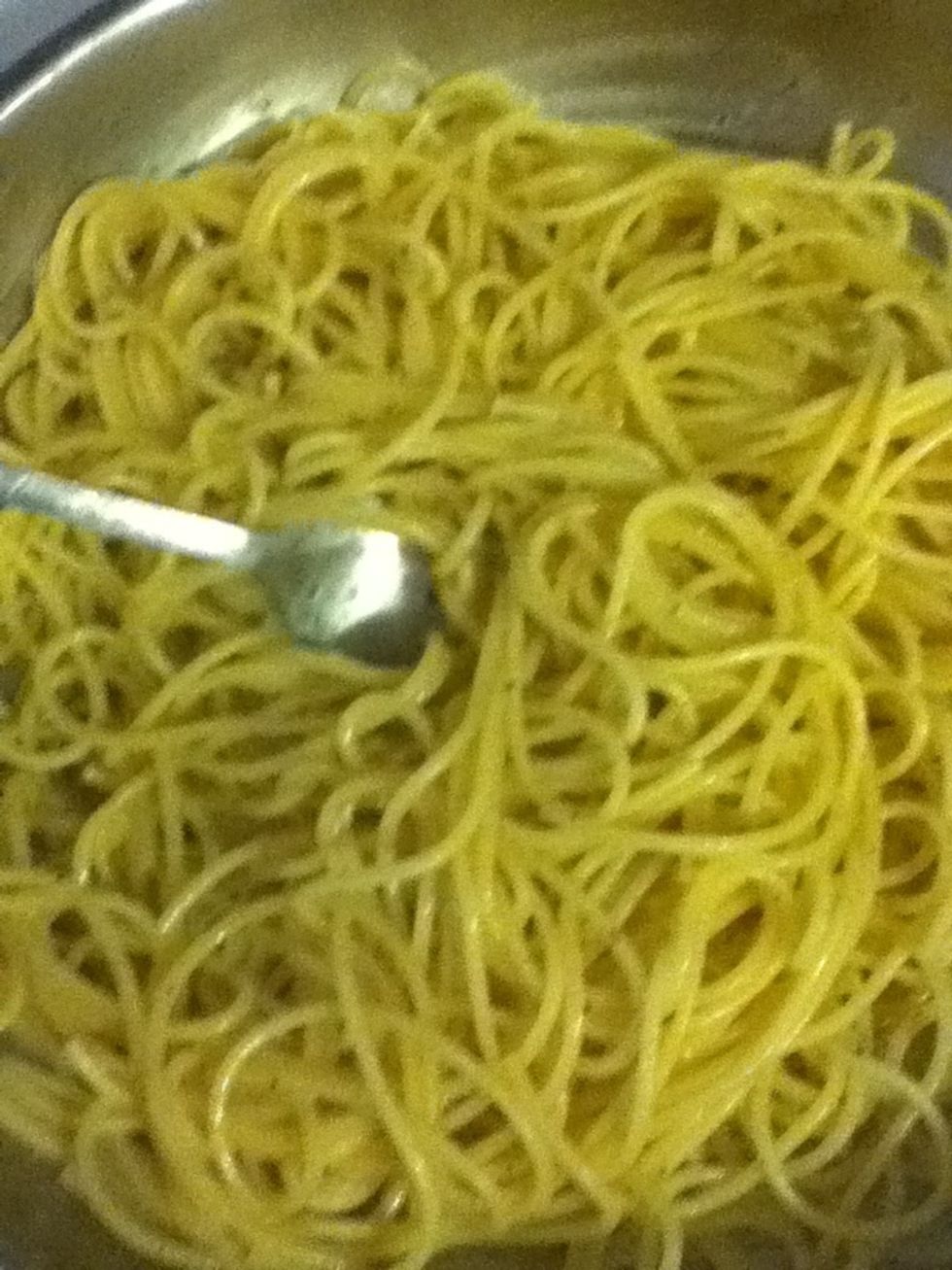 Toss it with a fork to coat it with the 'sauce'. Keep it moving!