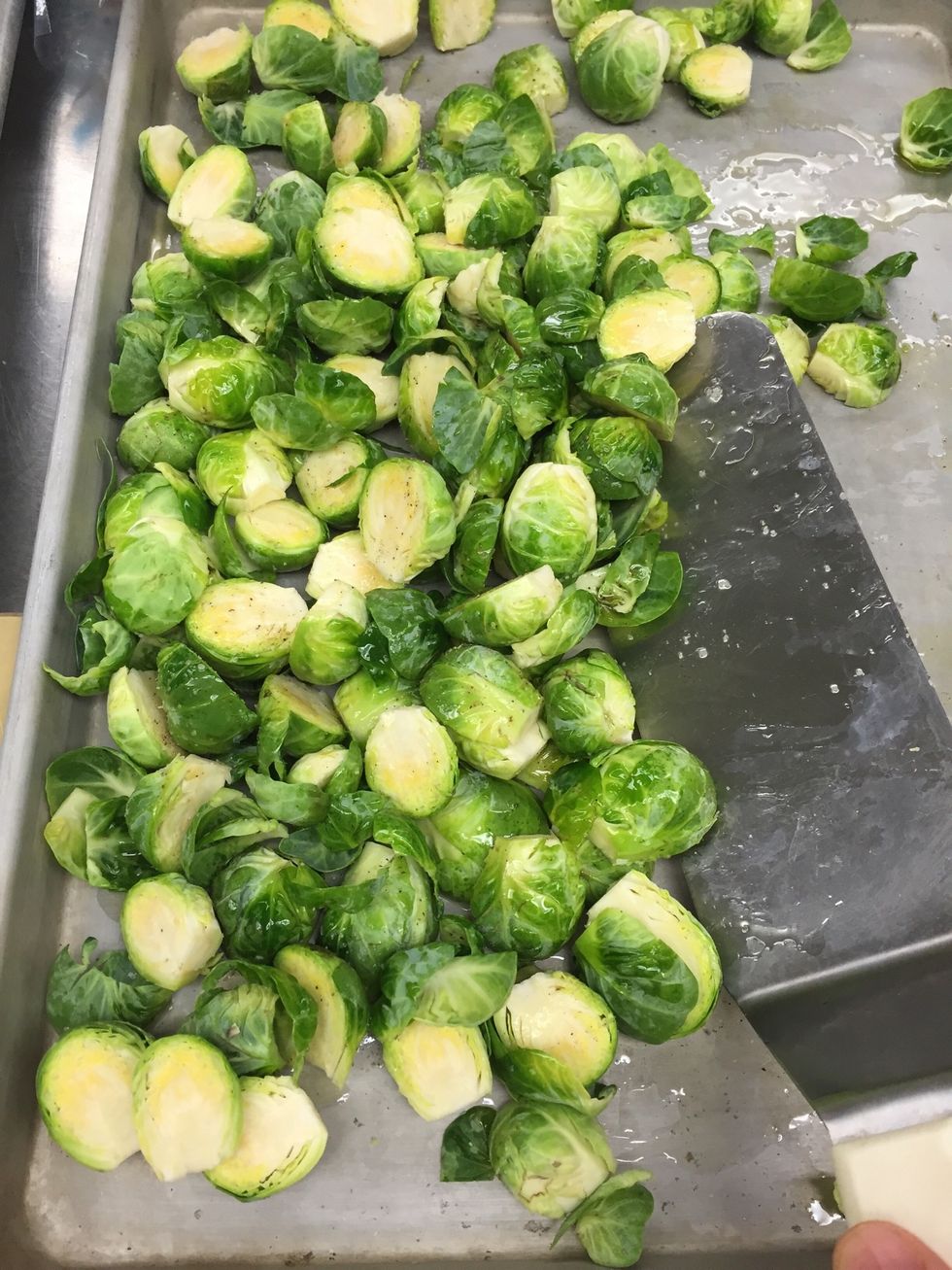 Toss on sheet tray until fully coated with olive oil.