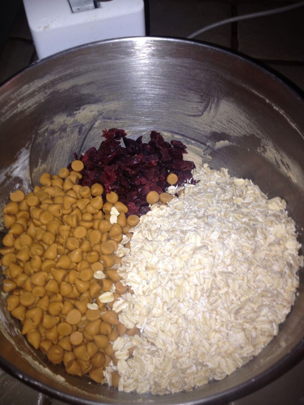Toss onto mixed dough in mixing bowl cranberries, butterscotch chips, and oatmeal.
